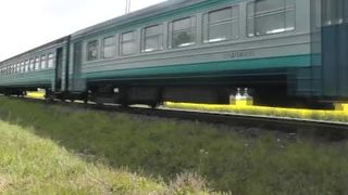 Naked in public. Woman without panties poses near train. Piss public. Outdoor