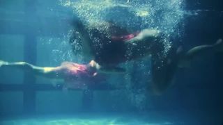 Lesbians and solo girls make out underwater