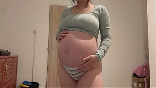 Pregnant Indian stepsister goes into the bathroom and shows off her big belly, then masturbates and plays with her pussy until she has an orgasm. She does a camel toe pussy and plays with her belly to
